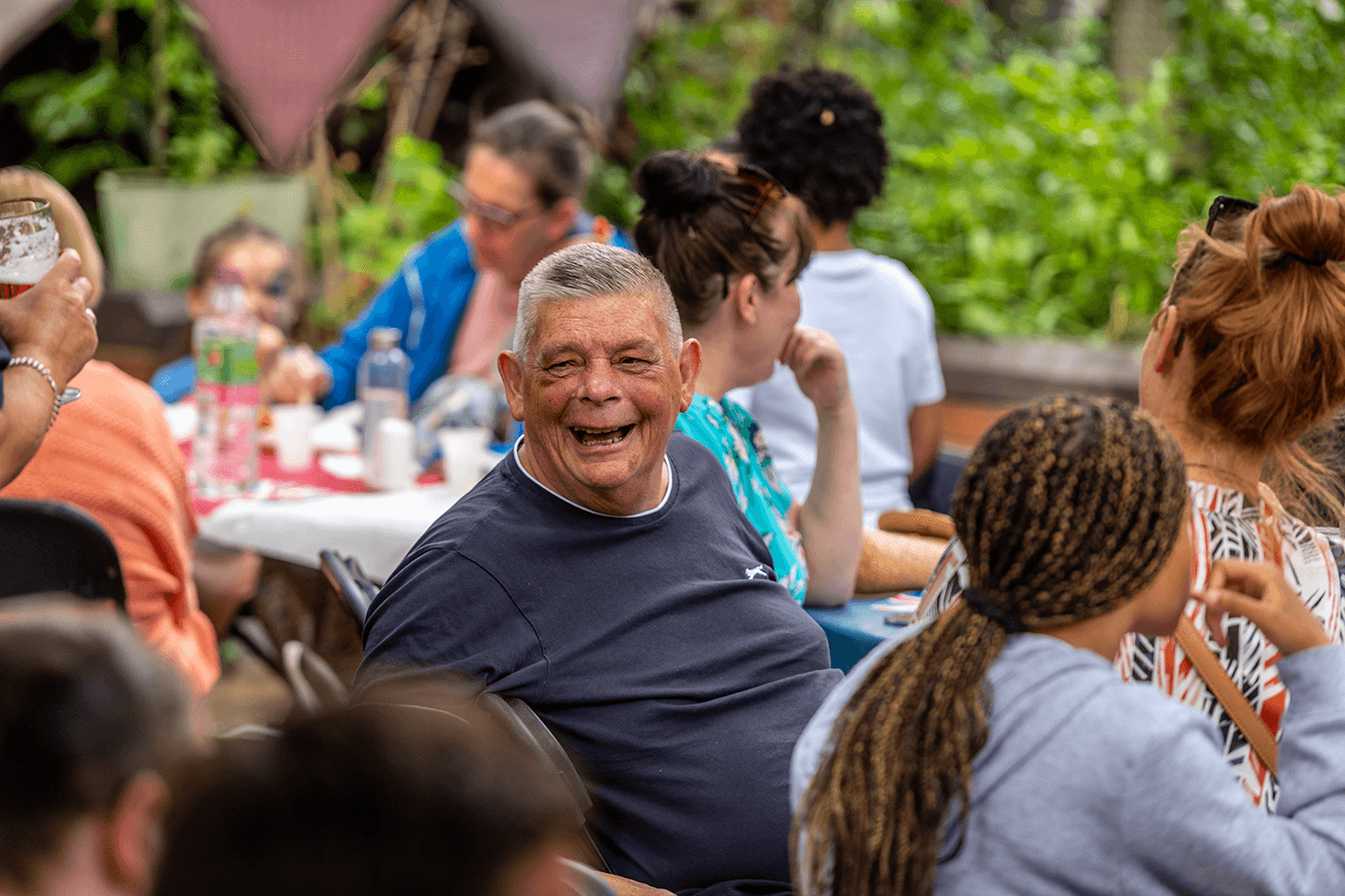 A resident laughing at a social event